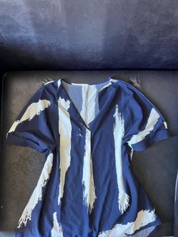 Loose fitting v neck women’s blouse with blue and white abstract pattern