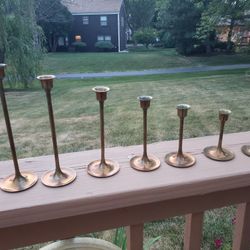 Seven Copper Candle Holders $20