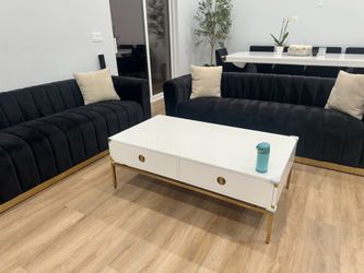 2 couches with coffee table and 4 pillows