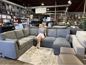 Grey fabric sectional couch with reversible chaise