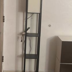 Target black tall lamp with 3 shelves it is like new 