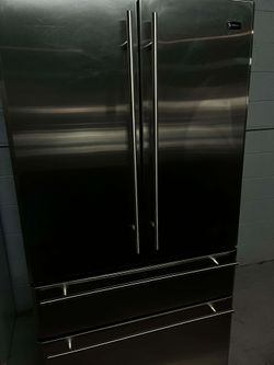 GE Monogram 36" wide French-Door Refrigerator with middle convertible drawer.