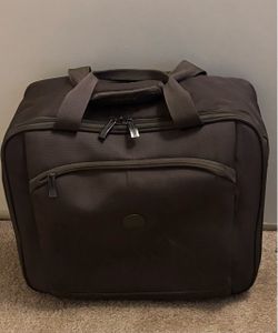 Brown luggage with wheels and handle
