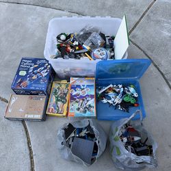Bucket of loose legos and some in the boxes