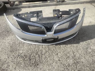 2013-2016 Lincoln MKS complete bumper with all the accessories OEM.