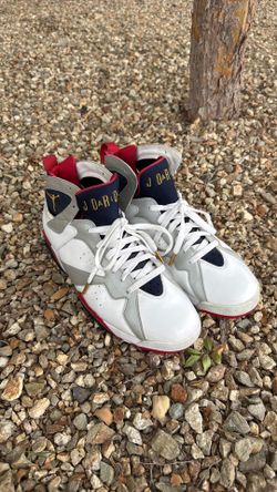 Jordan 7s (white/navy/red with the 9 on the back)