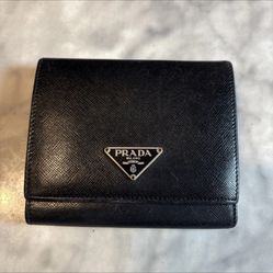 Vintage black Saffiano leather Prada trifold wallet.