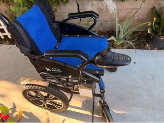 Culver Mobility Artemis blue foldable electric wheelchair.
