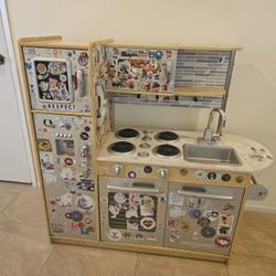 KidKraft Uptown Kitchen with fruits, vegetables, and plates