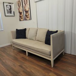 Cream Upholstered Sofa with Wood Frame