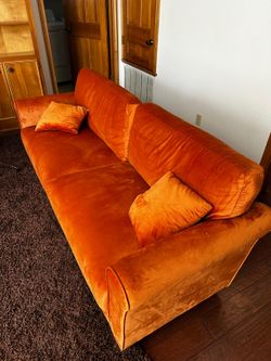 Orange Velvet Sofa with Matching Throw Pillows