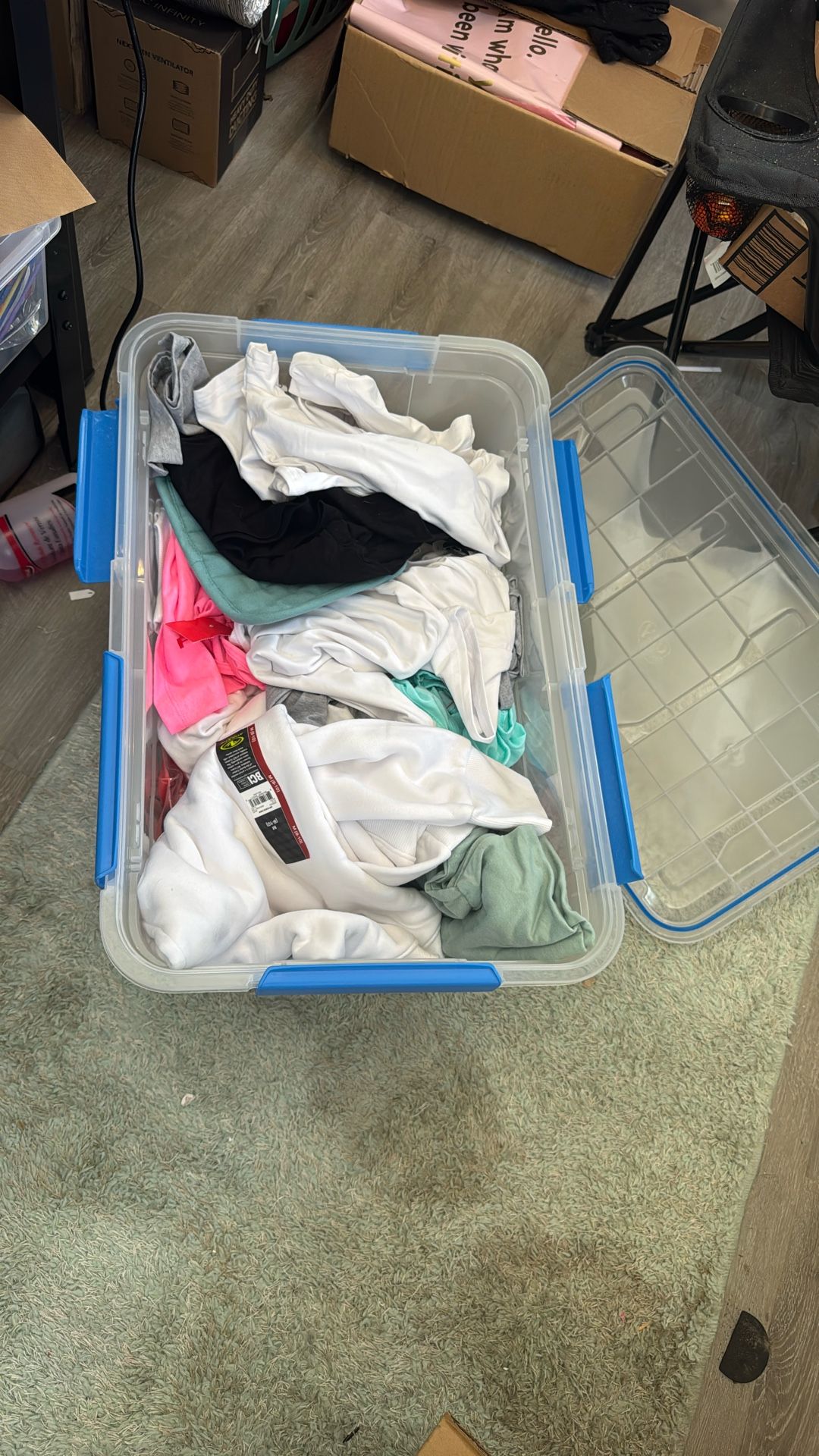Bin Full Of Shirts And Sweaters
