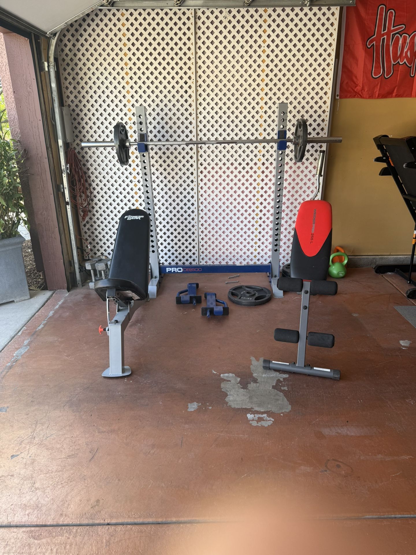 Benches (2) 4-45’s, 2-35’s, Curl bar, 7ft Bench Bar, 2-10’s, 2-15s, 2-25s, 2-25s And Bench Press Rack