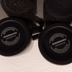 Two practically new Starbucks coffee mugs with lids