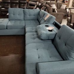 Blue fabric sectional with a drop down leaf