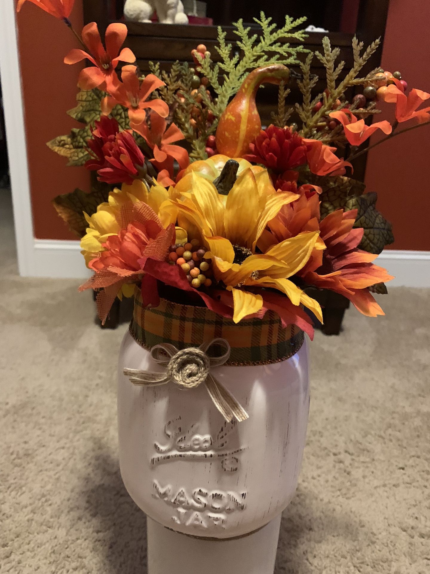 Large Ceramic Mason Jar In Aged White Finish Filled With Fall Flowers And Accents.