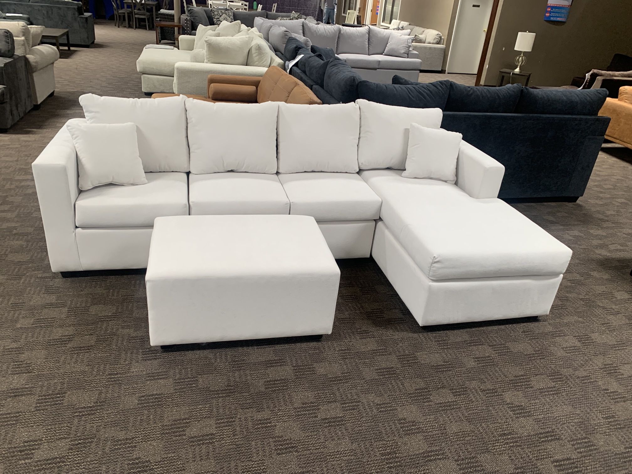 White Cream Sectional Couch And Ottoman