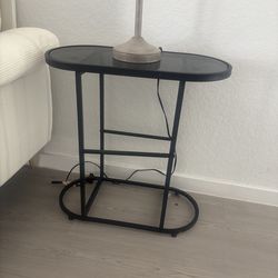 Mesa de noche color negra de vidrio