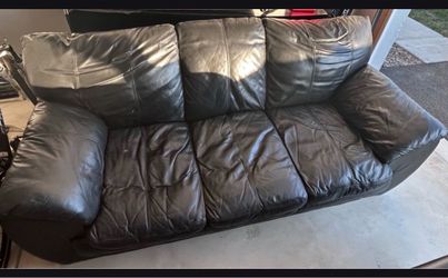 Love seat, sofa, and entertainment center