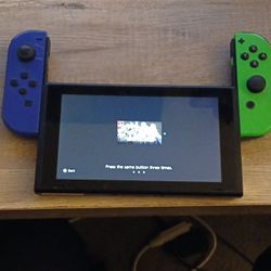 original Nintendo Switch HAC-001, 32GB, with the blue/green Joy-Cons and dock.