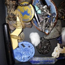 box of jewelry stones and hand carved trinkets 