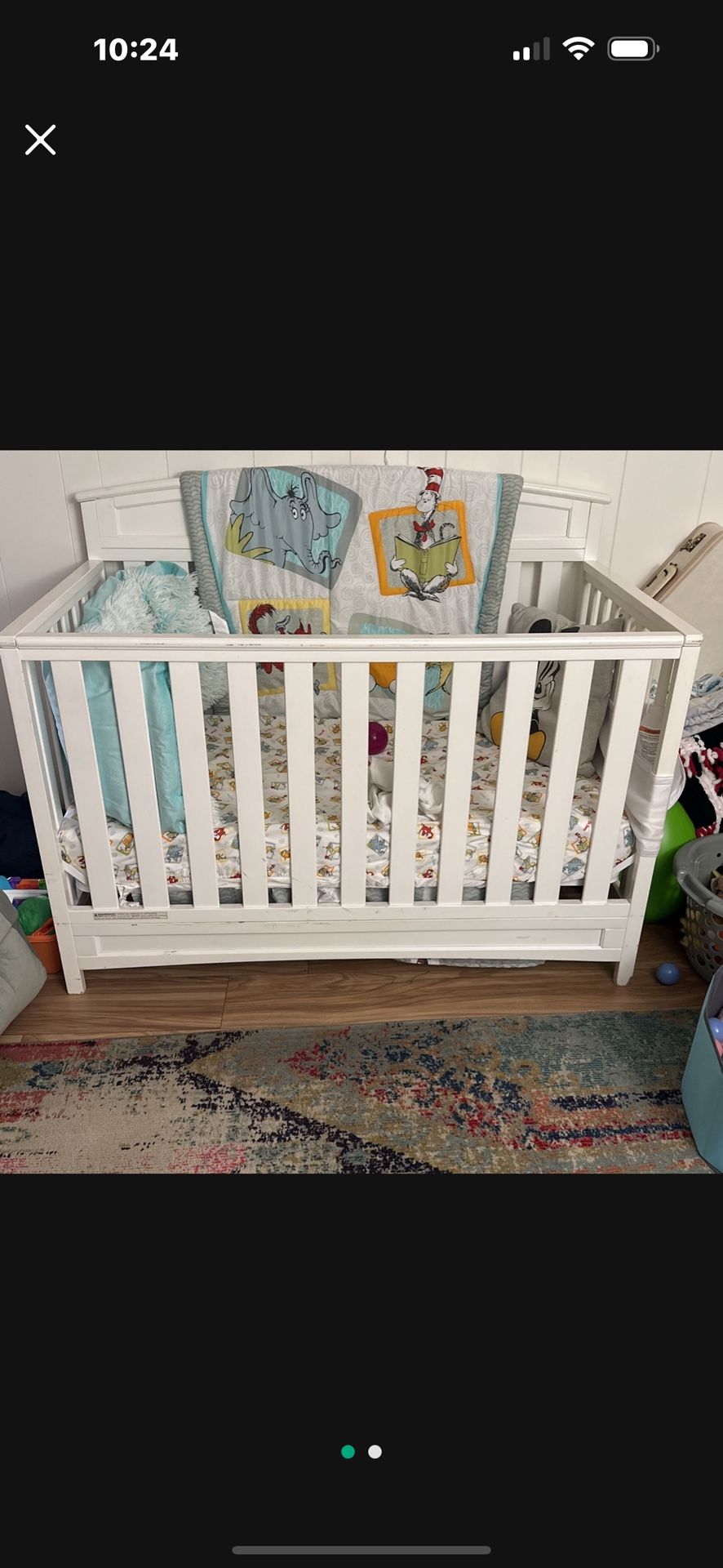 Baby crib with three levels of height adjustment. No mattress.