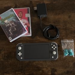 Nintendo Switch Lite (w/ charger, games, & control freaks)