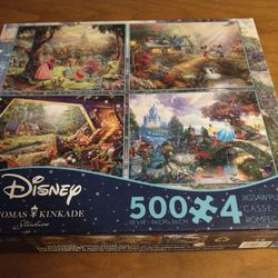 Disney 4 Thomas Kinkade 500 piece puzzles (sleeping beauty, Cinderella, snow white & Mickey and Minnie)
Box is open but puzzles are still new in seale