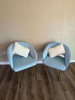 Two accent chairs and pillows