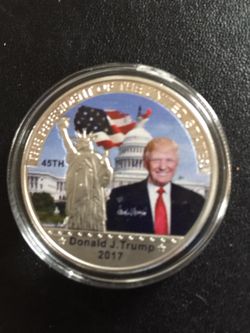 2017 souvenir with trumps picture on it