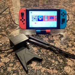 Nintendo Switch With Neón Blue And Neon Red Joy-con Plus TV Charger Stand