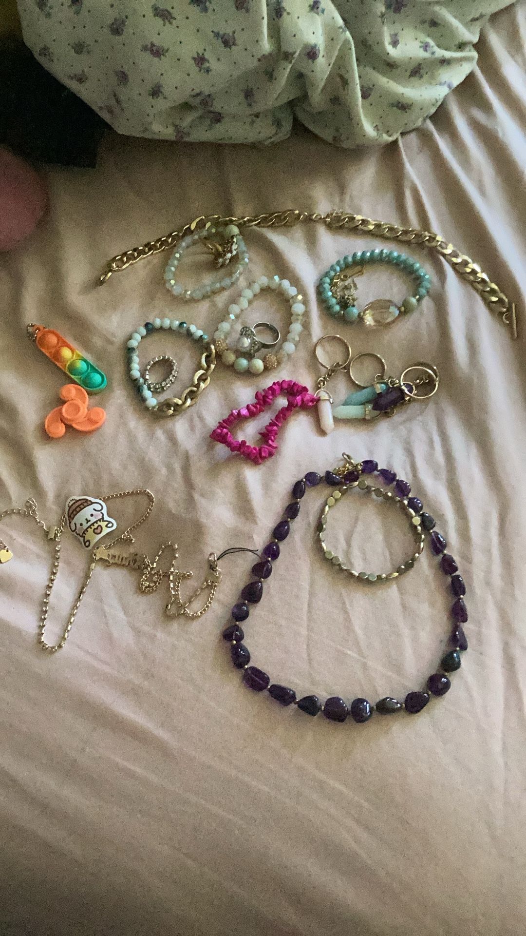 Colorful Jewelry(rings,bracelets, And Necklaces) And Two Pop it’s And Spinner