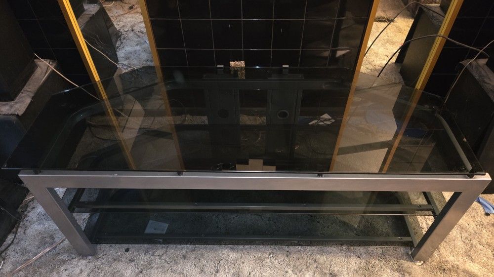 Free Smokey Glass TV stand for 65" or under