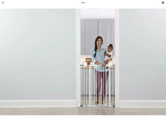 Baby gate extra tall. 41 inches high 36 inches wide is new