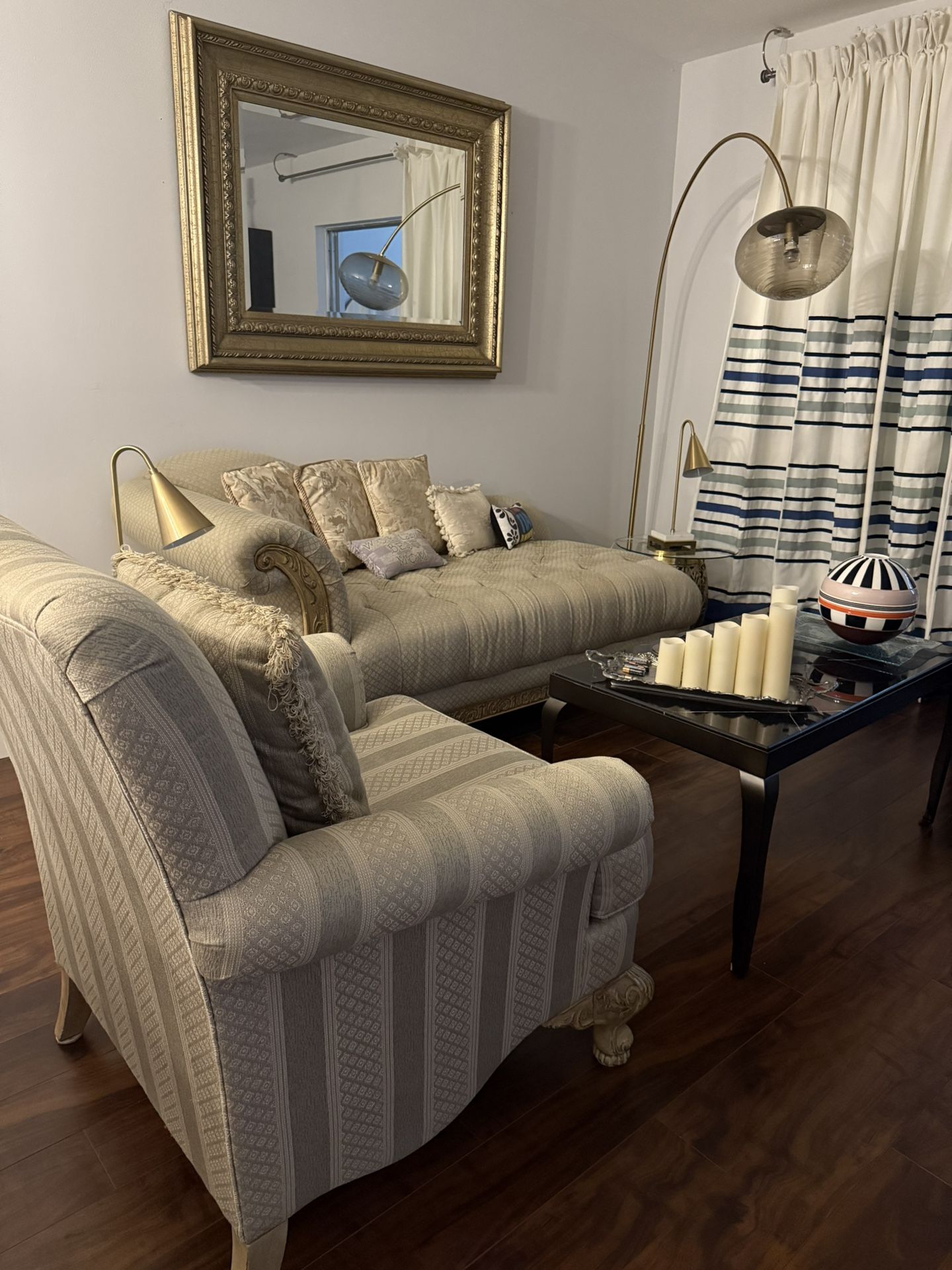 For sale in excellent condition: a complete living room set, including a sofa with side chair, two side tables with glass tops and gold bases, two lam