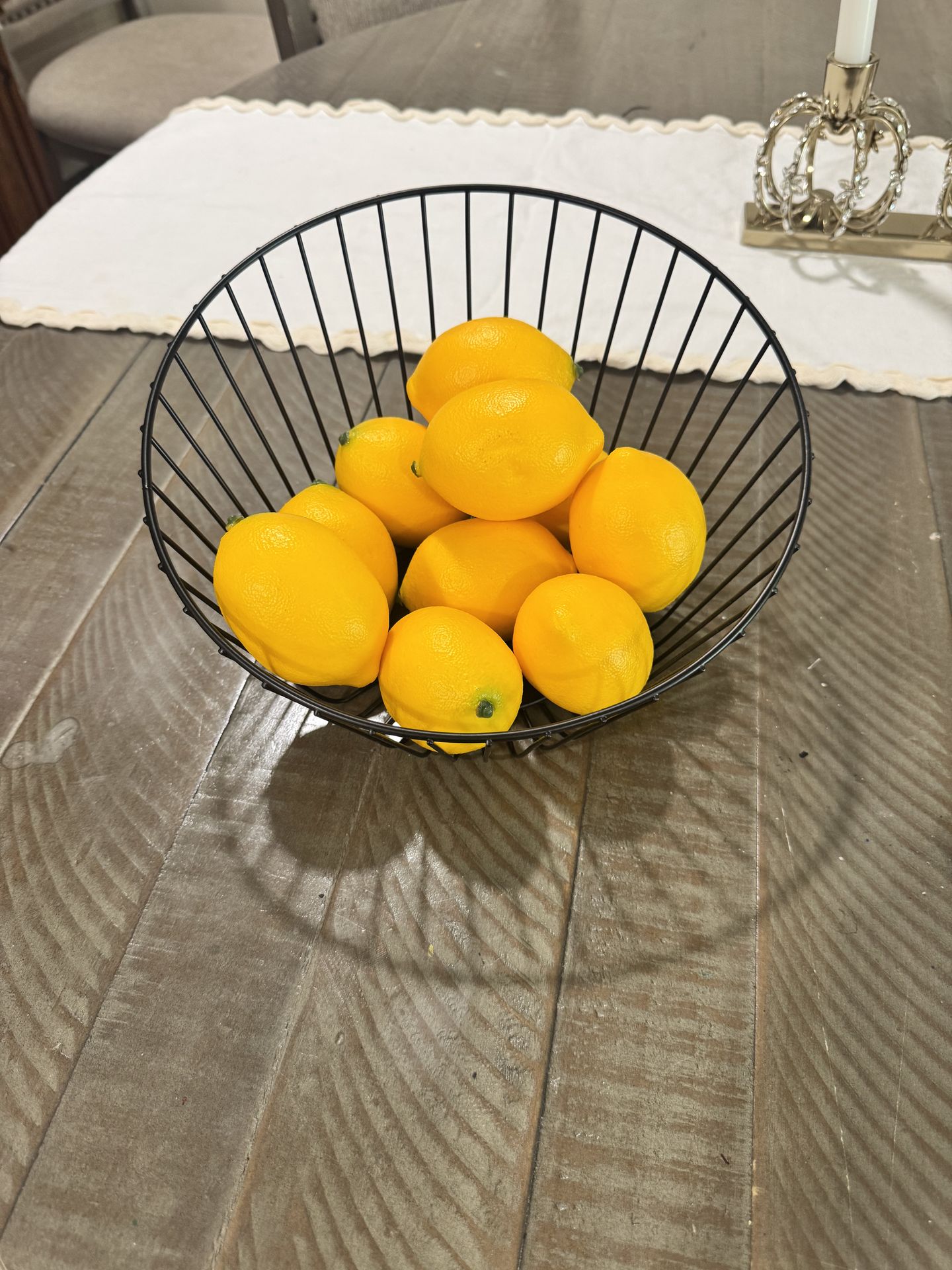 Black wire bowl with fake lemons