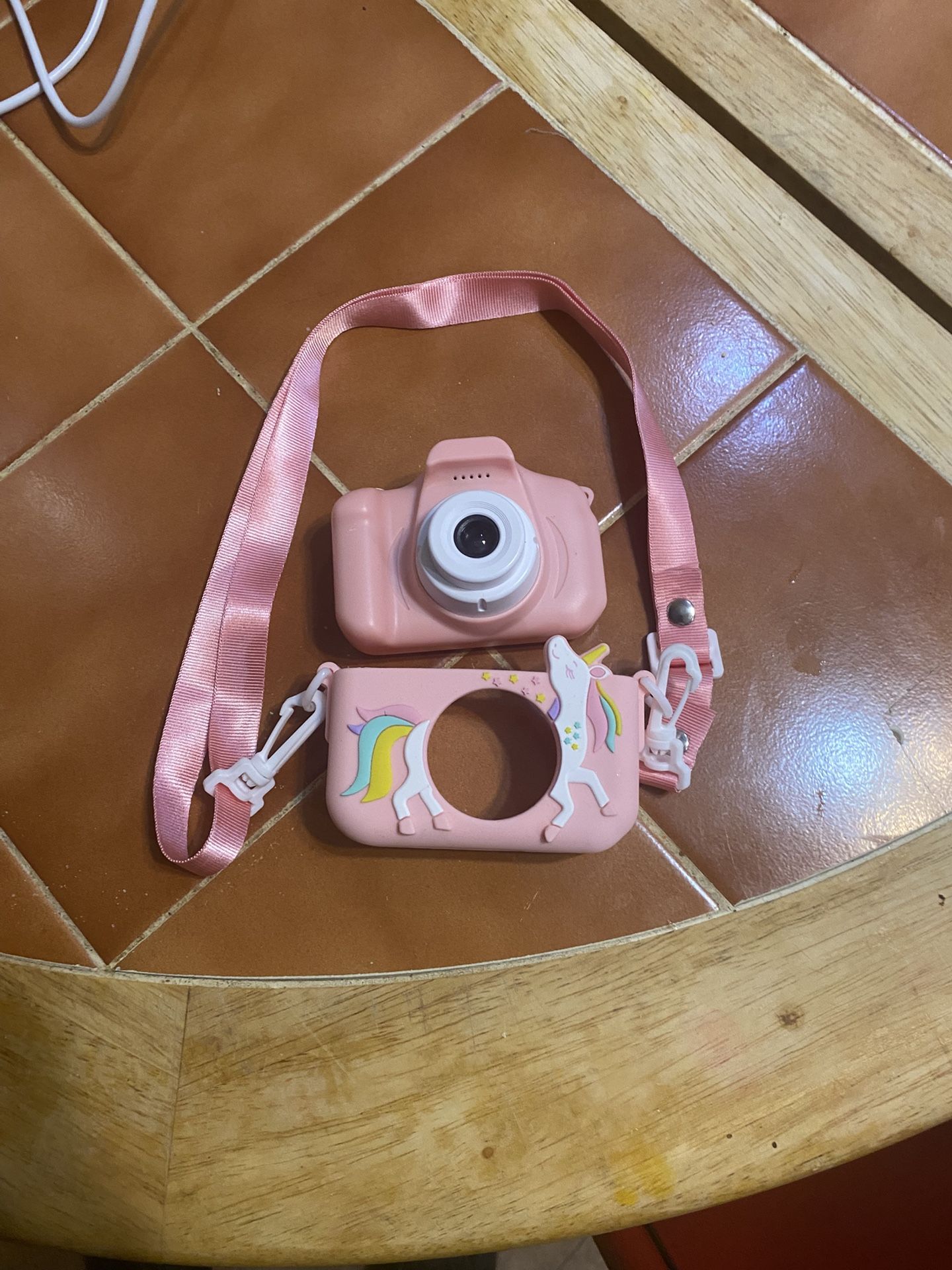 digital camera And a pink unicorn silicone case