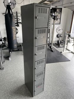 6-door vertical locker, (6’ H x 1’ W x 18” deep) all lockable.  In Good Used Condition.