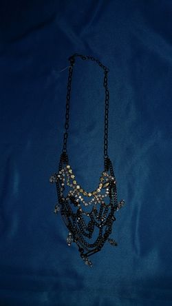 Black, silver, and gold draping necklace