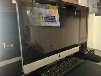 27” Mac computer with wireless keyboard and mouse