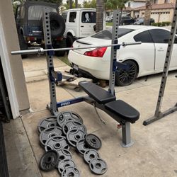 Bench press/squat rack with 270lbs of Olympic weights and 7ft 45lbs bar firm price