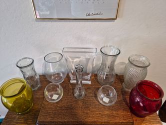 Assorted glass vases in various shapes and colors.