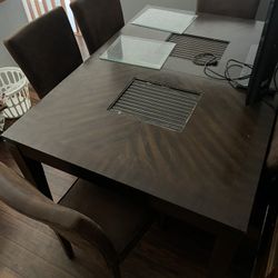 Dining table and 6 chairs in good condition.