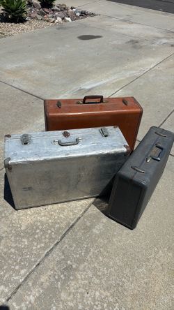 Three vintage suitcases