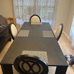 Kitchen table and chairs  with extension leaf. Price negotioble
