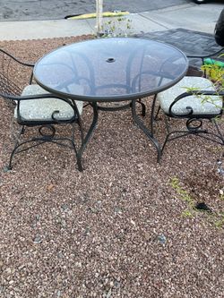 patio table with two chairs