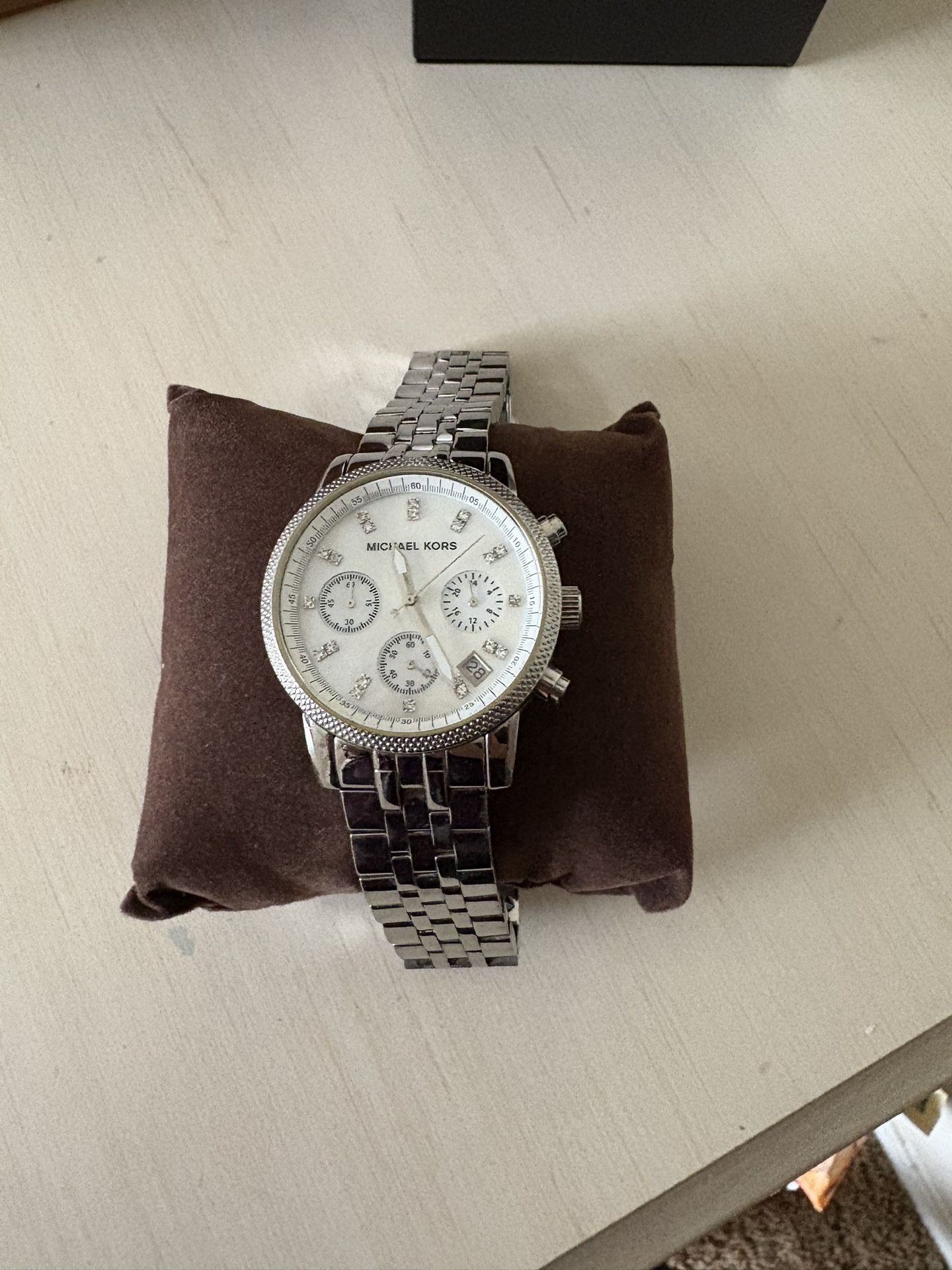 Women’s Michael Kors chronograph with a stainless steel bracelet and a mother-of-pearl dial