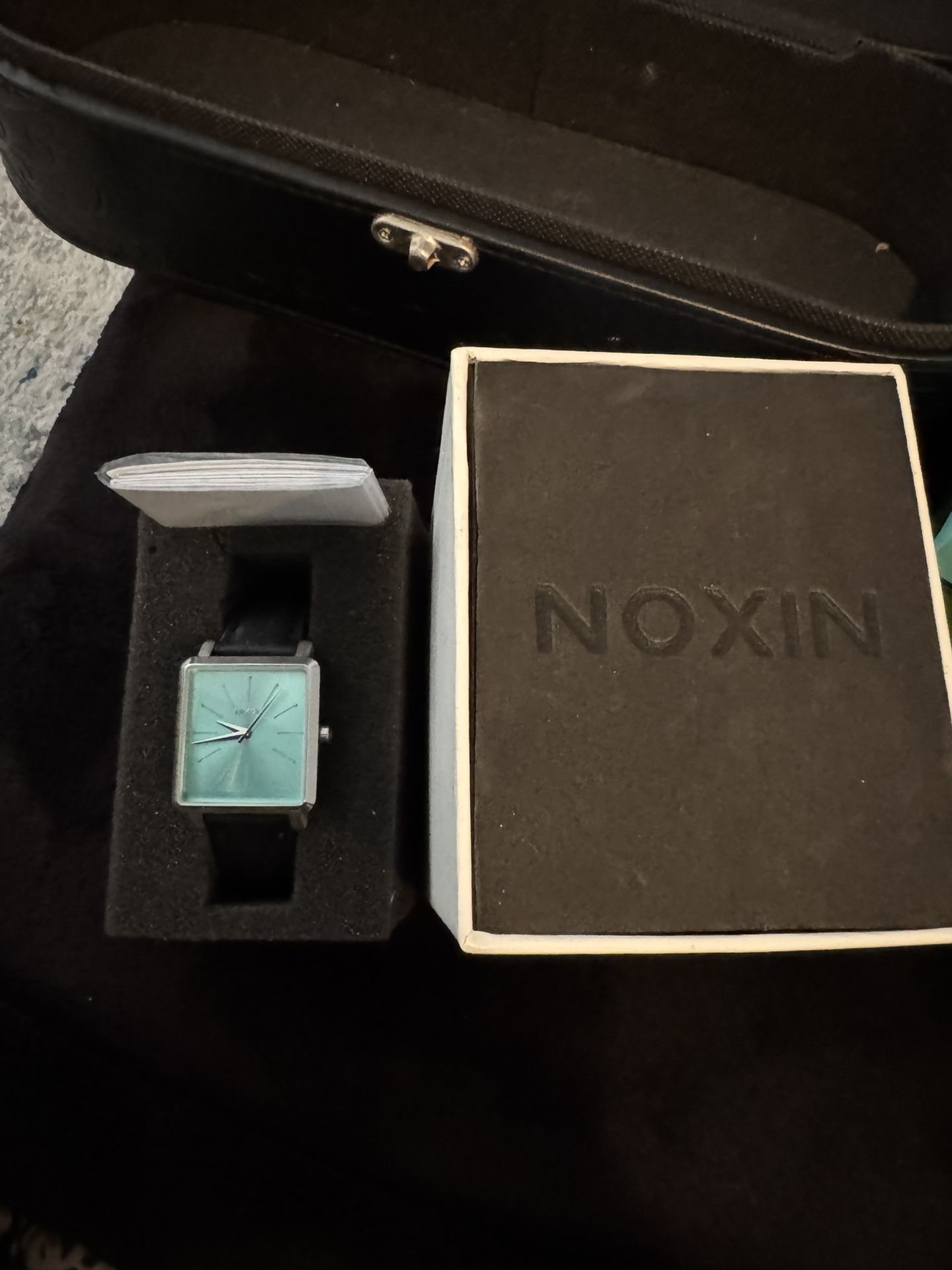 NOXIN watch, featuring a rectangular turquoise face