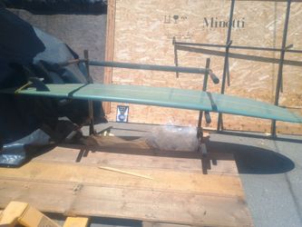 9ft surf board with stand.