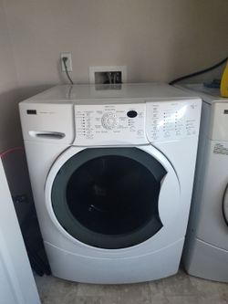 A pair washer and electric dryer both Kenmore elite he4